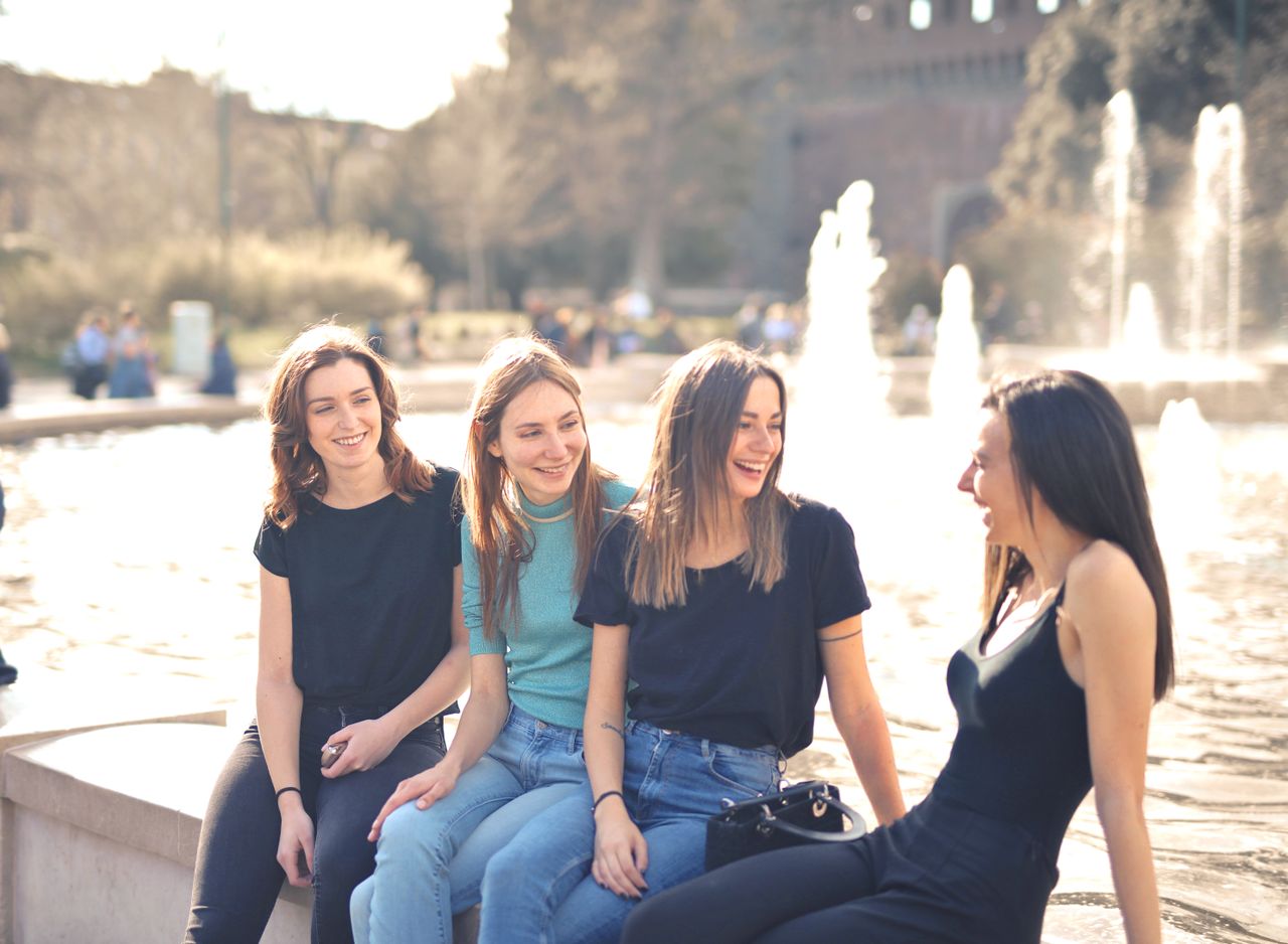 Friends laughing together after joining as a team