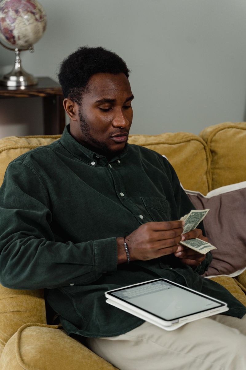 A young man finishing a task on his phone